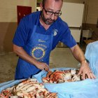Lemoore Rotarian Victor Rosa inspects a tub of crab during Saturday night's annual Lemoore Rotary Crab Feed.